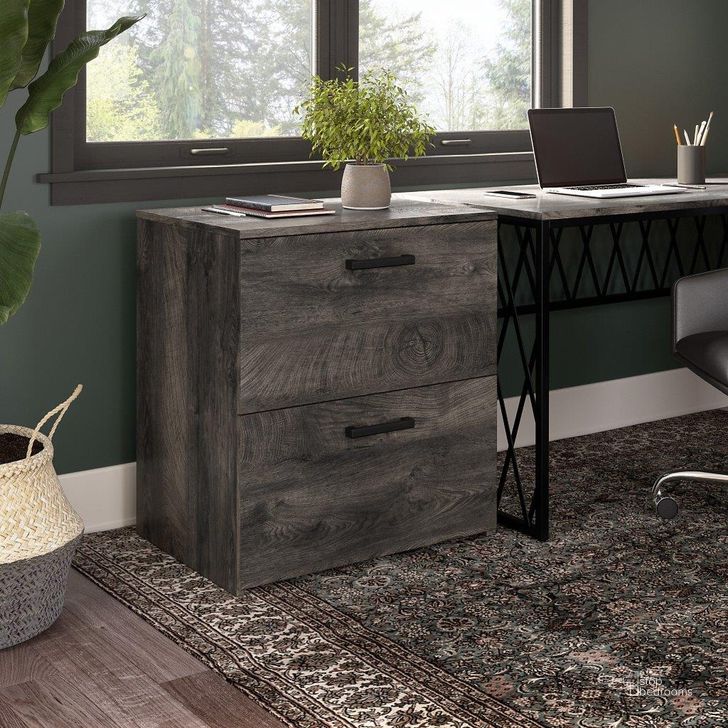 The appearance of Kathy Ireland Home By Bush Furniture City Park 2 Drawer Lateral File Cabinet In Dark Gray Hickory designed by Bush Furniture in the industrial interior design. This dark gray piece of furniture  was selected by 1StopBedrooms from City Park Collection to add a touch of cosiness and style into your home. Sku: CPF127GH-03. Material: Wood. Product Type: File Cabinet. Image1