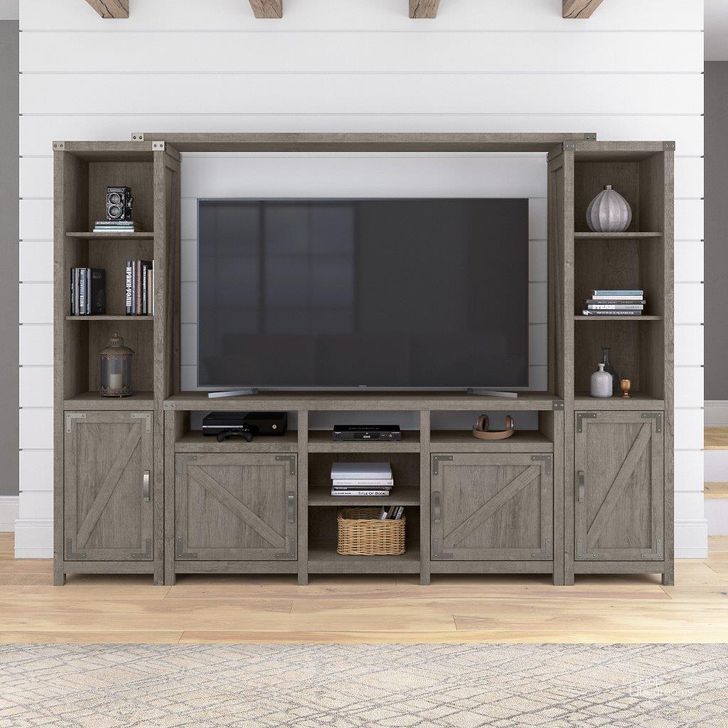 The appearance of Kathy Ireland Home by Bush Furniture Cottage Grove 65W Farmhouse Entertainment Center with Shelves in Restored Gray designed by Bush Furniture in the country / farmhouse interior design. This gray piece of furniture  was selected by 1StopBedrooms from Cottage Grove Collection to add a touch of cosiness and style into your home. Sku: CGR023RTG. Material: Wood. Product Type: Entertainment Center. Image1