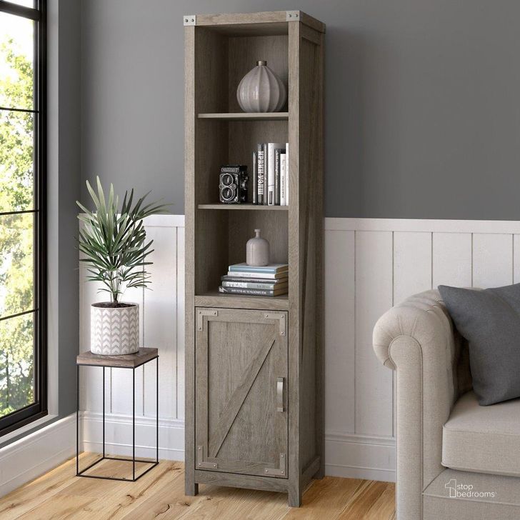 The appearance of Kathy Ireland Home by Bush Furniture Cottage Grove Tall Narrow 5 Shelf Bookcase with Door in Restored Gray designed by Bush Furniture in the country / farmhouse interior design. This gray piece of furniture  was selected by 1StopBedrooms from Cottage Grove Collection to add a touch of cosiness and style into your home. Sku: CGB118RTG-03. Material: Wood. Product Type: Bookcase. Image1