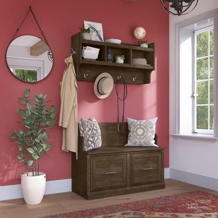 The appearance of Kathy Ireland Home by Bush Furniture Woodland 40W Entryway Bench with Doors and Wall Mounted Coat Rack in Ash Brown designed by Bush Furniture in the traditional interior design. This brown piece of furniture  was selected by 1StopBedrooms from Woodland Collection to add a touch of cosiness and style into your home. Sku: WDL009ABR. Product Type: Entryway Furniture. Image1