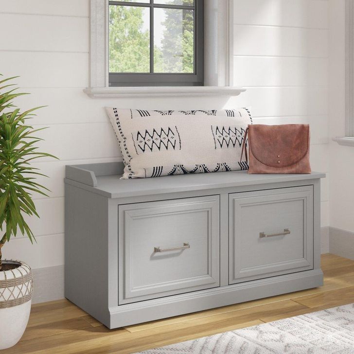 The appearance of Kathy Ireland Home by Bush Furniture Woodland 40W Shoe Storage Bench with Doors in Cape Cod Gray designed by Bush Furniture in the traditional interior design. This gray piece of furniture  was selected by 1StopBedrooms from Woodland Collection to add a touch of cosiness and style into your home. Sku: WDS140CG-03. Product Type: Shoe Cabinet. Image1