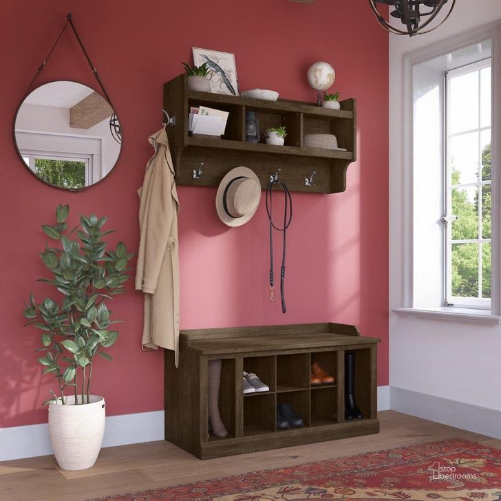 The appearance of Kathy Ireland Home by Bush Furniture Woodland 40W Shoe Storage Bench with Shelves and Wall Mounted Coat Rack in Ash Brown designed by Bush Furniture in the traditional interior design. This brown piece of furniture  was selected by 1StopBedrooms from Woodland Collection to add a touch of cosiness and style into your home. Sku: WDL004ABR. Product Type: Shoe Cabinet. Image1