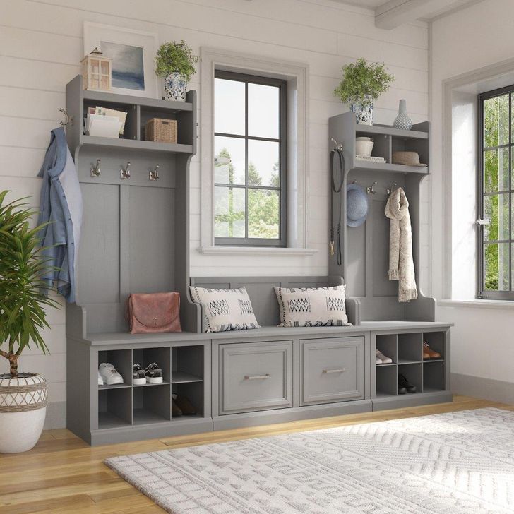 The appearance of Kathy Ireland Home by Bush Furniture Woodland Entryway Storage Set with Hall Trees and Shoe Bench with Doors in Cape Cod Gray designed by Bush Furniture in the traditional interior design. This gray piece of furniture  was selected by 1StopBedrooms from Woodland Collection to add a touch of cosiness and style into your home. Sku: WDL011CG. Product Type: Entryway Furniture. Image1