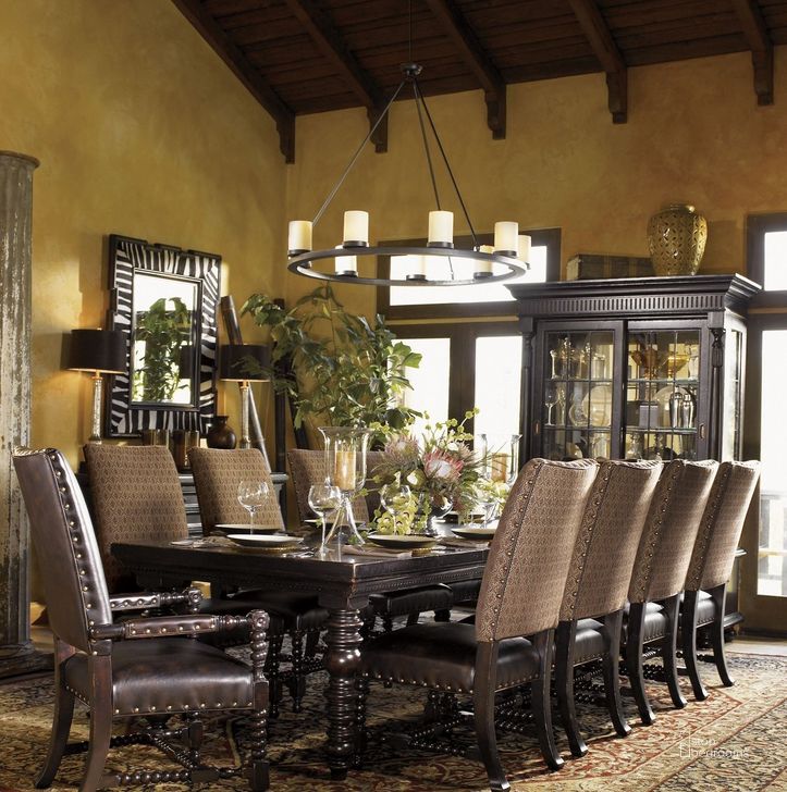 The appearance of Kingstown Rich Tamarind Pembroke Extendable Rectangular Dining Room Set designed by Tommy Bahama in the traditional interior design. This brown piece of furniture  was selected by 1StopBedrooms from Kingstown Collection to add a touch of cosiness and style into your home. Sku: 01-0619-877;01-0619-884-01. Table Base Style: Legs. Material: Leather. Product Type: Dining Room Set. Table Top Shape: Rectangular. Size: 72". Image1