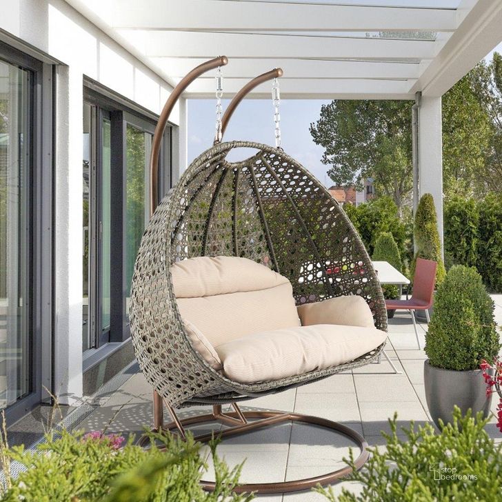 The appearance of LeisureMod Beige Wicker Hanging 2 person Egg Swing Chair ESC57BG designed by LeisureMod in the modern / contemporary interior design. This beige piece of furniture  was selected by 1StopBedrooms from  to add a touch of cosiness and style into your home. Sku: ESC57BG. Product Type: Outdoor Chair. Material: Wicker. Image1