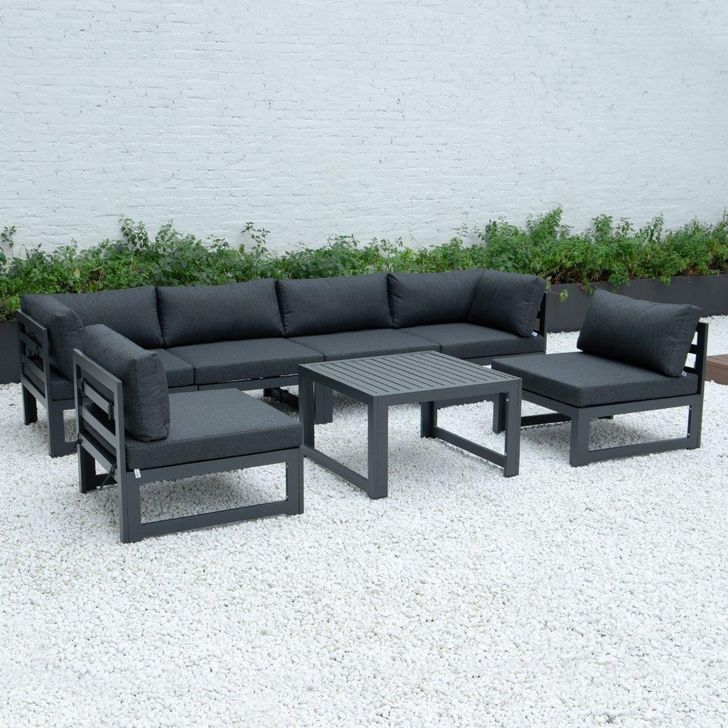 The appearance of Leisuremod Chelsea 7-Piece Patio Sectional And Coffee Table Set With Cushions CSTBL-7BL designed by LeisureMod in the modern / contemporary interior design. This black piece of furniture  was selected by 1StopBedrooms from Chelsea Collection to add a touch of cosiness and style into your home. Sku: CSTBL-7BL. Material: Aluminum. Product Type: Outdoor Sectional. Image1