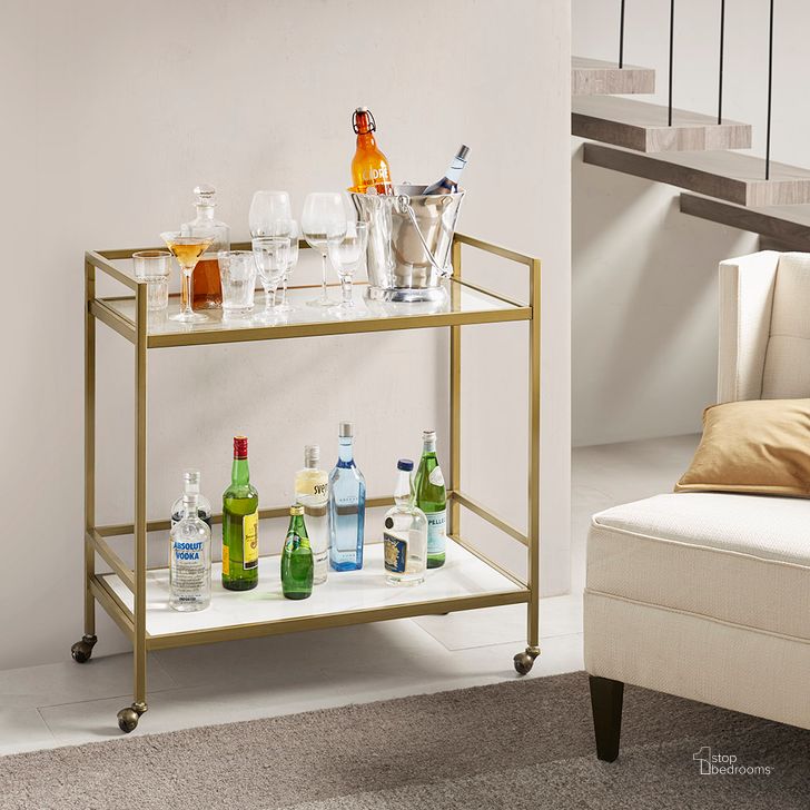The appearance of Lionel Bar Cart In Antique Gold designed by Olliix in the glam interior design. This antique gold piece of furniture  was selected by 1StopBedrooms from Lionel Collection to add a touch of cosiness and style into your home. Sku: MT135-0036. Material: Metal. Product Type: Bar Cart. Image1