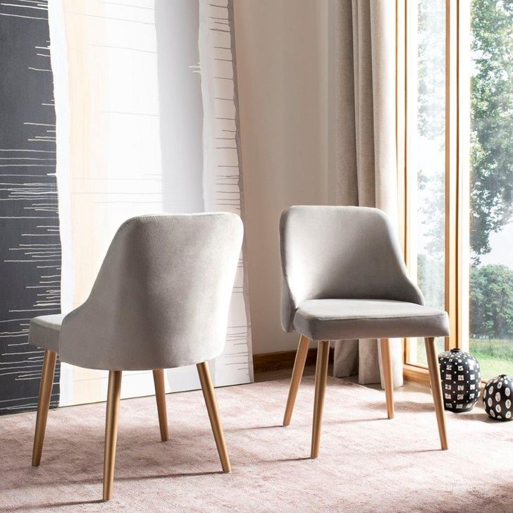 The appearance of Lulu Upholstered Dining Chair DCH6200A designed by Safavieh in the modern / contemporary interior design. This grey and gold piece of furniture  was selected by 1StopBedrooms from Safavieh DSK Collection to add a touch of cosiness and style into your home. Sku: DCH6200A-SET2. Material: Metal. Product Type: Dining Chair. Image1