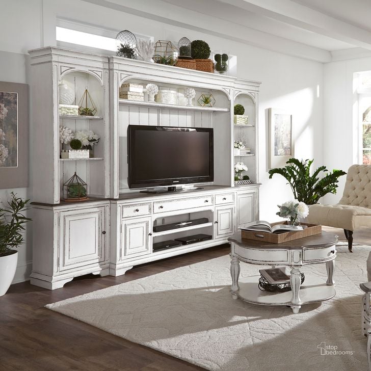 The appearance of Magnolia Manor Antique White Entertainment Wall Unit designed by Liberty in the rustic / southwestern interior design. This antique white piece of furniture  was selected by 1StopBedrooms from Magnolia Manor Collection to add a touch of cosiness and style into your home. Sku: 244-EC00;244-EL00;244-ER00;244-TV70. Material: Wood. Product Type: Entertainment Centers and Wall. Image1