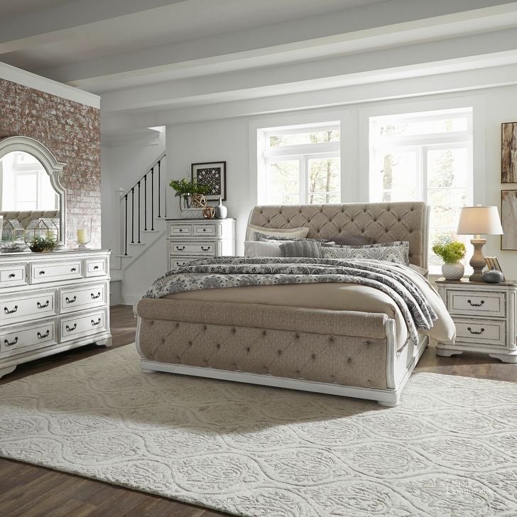 The appearance of Magnolia Manor Antique White Upholstered Sleigh Bedroom Set designed by Liberty in the rustic / southwestern interior design. This antique white piece of furniture  was selected by 1StopBedrooms from Magnolia Manor Collection to add a touch of cosiness and style into your home. Sku: 244-BR21FU;244-BR21HU;244-BR92;244-BR62. Bed Type: Sleigh Bed. Material: Wood. Product Type: Sleigh Bed. Bed Size: Queen. Image1
