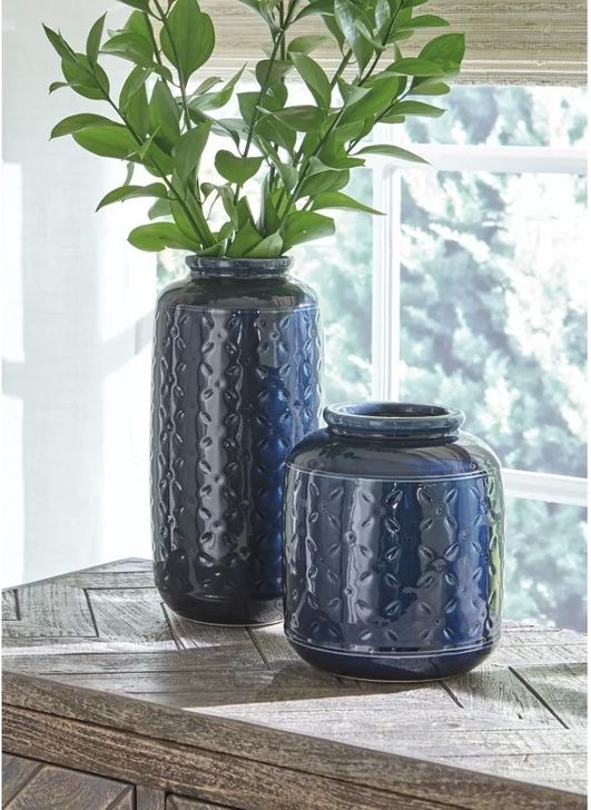 The appearance of Marenda Navy Blue Vase Set of 2 designed by Signature Design by Ashley in the modern / contemporary interior design. This navy blue piece of furniture  was selected by 1StopBedrooms from Marenda Collection to add a touch of cosiness and style into your home. Sku: A2000130. Material: Ceramic. Product Type: Vase. Image1