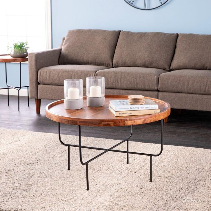 The appearance of Marisdale Round Coffee Table designed by SEI Furniture in the modern / contemporary interior design. This natural piece of furniture  was selected by 1StopBedrooms from Marisdale Collection to add a touch of cosiness and style into your home. Sku: CK1215700. Product Type: Coffee Table. Material: Iron. Image1
