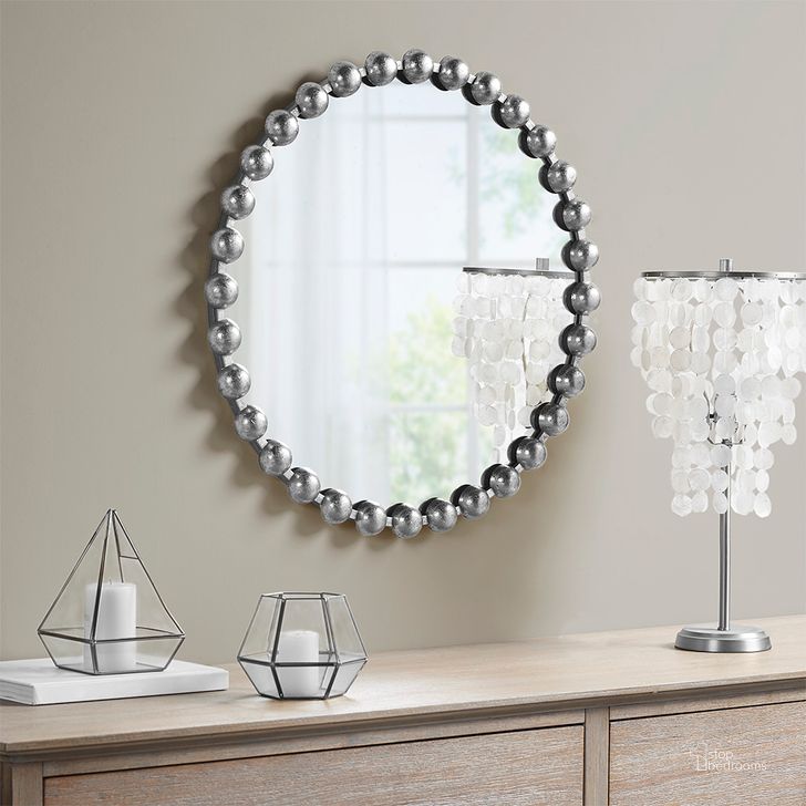The appearance of Marlowe Round Wall Decor Mirror In Silver MPS95F-0035 designed by Olliix in the modern / contemporary interior design. This silver piece of furniture  was selected by 1StopBedrooms from Marlowe Collection to add a touch of cosiness and style into your home. Sku: MPS95F-0035. Product Type: Mirror. Material: MDF. Image1
