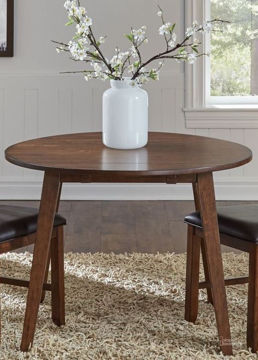 The appearance of Mason Medium Mango 42" Extendable Round Dining Table designed by A-America in the transitional interior design. This brown piece of furniture  was selected by 1StopBedrooms from Mason Collection to add a touch of cosiness and style into your home. Sku: MASMA6100. Table Base Style: Legs. Table Top Shape: Round. Product Type: Dining Table. Material: Rubberwood. Image1