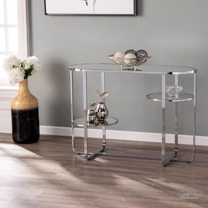 The appearance of Maxina Mirrored Console Table With Storage designed by SEI Furniture in the modern / contemporary interior design. This chrome piece of furniture  was selected by 1StopBedrooms from Maxina Collection to add a touch of cosiness and style into your home. Sku: CM1080903. Product Type: Console Table. Material: Iron. Image1