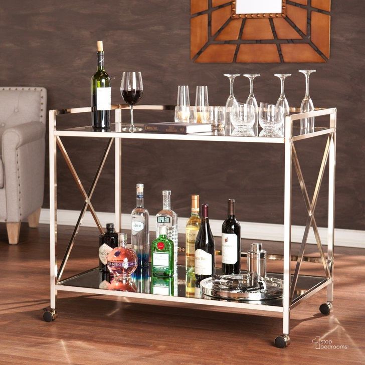 The appearance of Maxton Bar Cart designed by SEI Furniture in the glam interior design. This gold piece of furniture  was selected by 1StopBedrooms from Maxton Collection to add a touch of cosiness and style into your home. Sku: HZ2041. Product Type: Bar Cart. Material: Iron. Image1