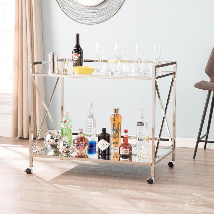 The appearance of Maxton Silver Bar Cart designed by SEI Furniture in the glam interior design. This chrome piece of furniture  was selected by 1StopBedrooms from Maxton Collection to add a touch of cosiness and style into your home. Sku: HZ2040. Product Type: Bar Cart. Material: Iron. Image1