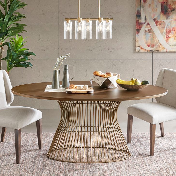The appearance of Mercer Oval Dining Table In Bronze designed by Olliix in the transitional interior design. This bronze piece of furniture  was selected by 1StopBedrooms from Mercer Collection to add a touch of cosiness and style into your home. Sku: IIF20-0062. Table Base Style: Pedestal. Table Top Shape: Oval. Product Type: Dining Table. Material: MDF. Size: 38". Image1