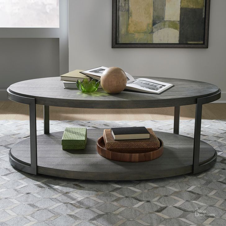 The appearance of Modern View Oval Cocktail Table In Gauntlet Gray designed by Liberty in the modern / contemporary interior design. This gray piece of furniture  was selected by 1StopBedrooms from Modern View Collection to add a touch of cosiness and style into your home. Sku: 960-OT1012T;960-OT1012B. Product Type: Cocktail Table. Material: Wood Veneer. Image1