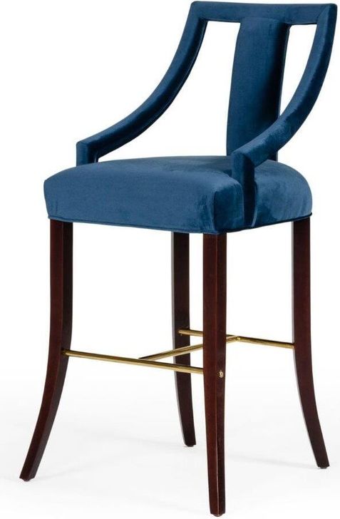 The appearance of Modrest Kimball Glam Blue Velvet Bar Stool designed by VIG Furniture in the glam interior design. This blue piece of furniture  was selected by 1StopBedrooms from Modrest Collection to add a touch of cosiness and style into your home. Sku: VGUIHERSA. Material: Wood. Product Type: Barstool. Image1