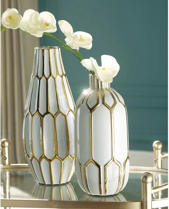 The appearance of Mohsen Gold and White Vase Set of 2 designed by Signature Design by Ashley in the modern / contemporary interior design. This gold/white piece of furniture  was selected by 1StopBedrooms from Mohsen Collection to add a touch of cosiness and style into your home. Sku: A2000135. Material: Ceramic. Product Type: Vase. Image1