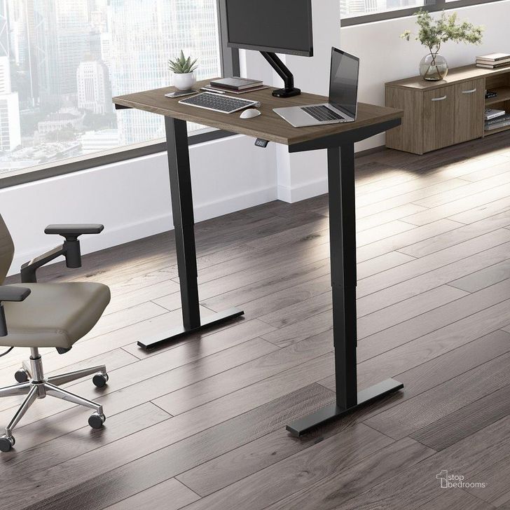The appearance of Move 40 Series by Bush Business Furniture 48W x 24D Electric Height Adjustable Standing Desk in Modern Hickory with Black Base designed by Bush Furniture in the transitional interior design. This modern hickory piece of furniture  was selected by 1StopBedrooms from Move 40 Series Collection to add a touch of cosiness and style into your home. Sku: M4S4824MHBK. Product Type: Desk. Image1