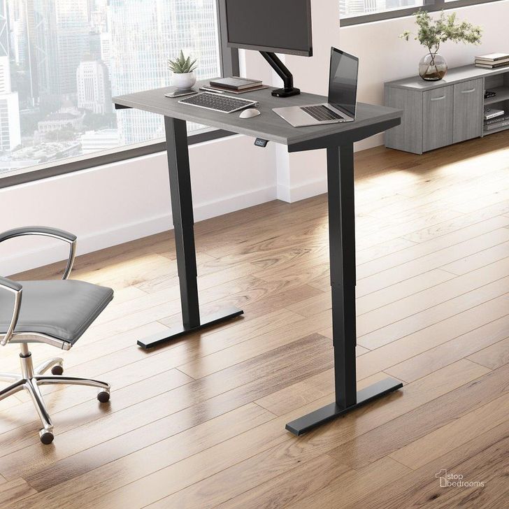 The appearance of Move 40 Series by Bush Business Furniture 48W x 24D Electric Height Adjustable Standing Desk in Platinum Gray with Black Base designed by Bush Furniture in the modern / contemporary interior design. This platinum gray piece of furniture  was selected by 1StopBedrooms from Move 40 Series Collection to add a touch of cosiness and style into your home. Sku: M4S4824PGBK. Product Type: Desk. Image1