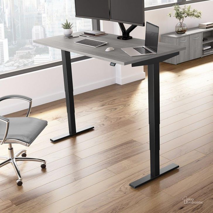 The appearance of Move 40 Series by Bush Business Furniture 60W x 30D Electric Height Adjustable Standing Desk in Platinum Gray with Black Base designed by Bush Furniture in the modern / contemporary interior design. This platinum gray piece of furniture  was selected by 1StopBedrooms from Move 40 Series Collection to add a touch of cosiness and style into your home. Sku: M4S6030PGBK. Product Type: Desk. Image1