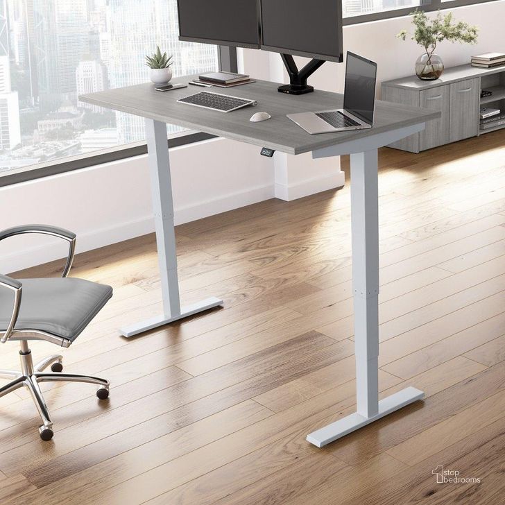 The appearance of Move 40 Series by Bush Business Furniture 60W x 30D Electric Height Adjustable Standing Desk in Platinum Gray designed by Bush Furniture in the transitional interior design. This platinum gray piece of furniture  was selected by 1StopBedrooms from Move 40 Series Collection to add a touch of cosiness and style into your home. Sku: M4S6030PGSK. Product Type: Desk. Image1