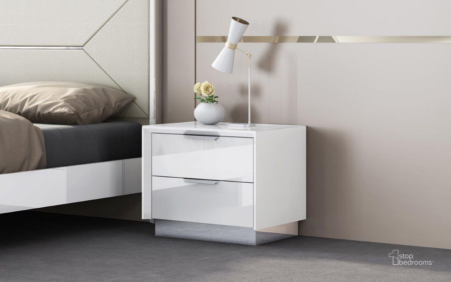 The appearance of Navi White Night Stand designed by Whiteline Modern Living in the modern / contemporary interior design. This white piece of furniture  was selected by 1StopBedrooms from Navi Collection to add a touch of cosiness and style into your home. Sku: NS1354-WHT. Product Type: Nightstand. Material: Stainless Steel. Image1