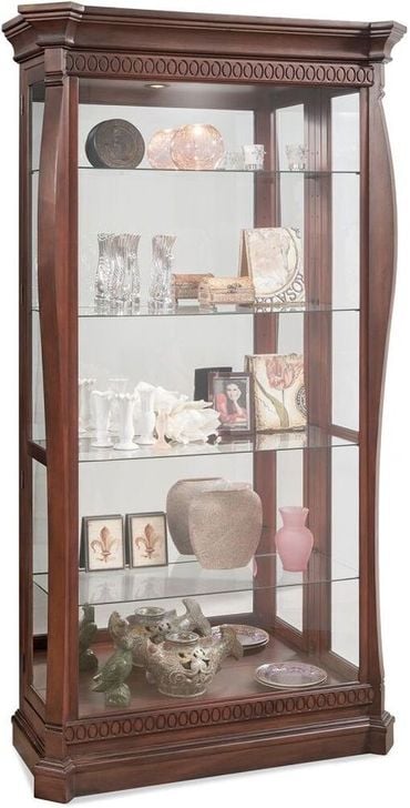 The appearance of Newcastle II Collectors Cabinet designed by Phillip Reinisch Co in the  interior design. This cherry piece of furniture  was selected by 1StopBedrooms from Lighthouse Collection to add a touch of cosiness and style into your home. Sku: 84782. Material: Wood. Product Type: Cabinet. Image1