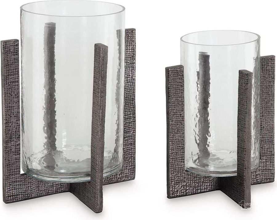The appearance of Nolchester Clear/Pewter Decorative Accessory Set of 2 designed by Off 5th Home in the transitional interior design. This clear/pewter piece of furniture  was selected by 1StopBedrooms from Nolchester Collection to add a touch of cosiness and style into your home. Sku: A2000591. Material: Glass. Product Type: Candle Holder. Image1