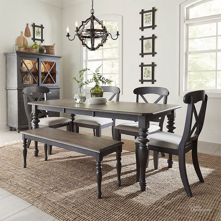 The appearance of Ocean Isle Rectangular Dining Room Set w/ Bench (Slate) designed by Liberty in the transitional interior design. This slate piece of furniture  was selected by 1StopBedrooms from Ocean Isle Collection to add a touch of cosiness and style into your home. Sku: 303G-T3872;303G-C9000B;303G-C3001S. Table Base Style: Legs. Material: Wood. Product Type: Dining Room Set. Table Top Shape: Rectangular. Image1