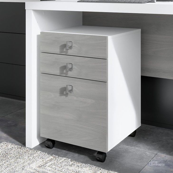 The appearance of Office by Kathy Ireland Echo 3 Drawer Mobile File Cabinet in Pure White and Modern Gray designed by Bush Furniture in the modern / contemporary interior design. This white and gray piece of furniture  was selected by 1StopBedrooms from Echo Collection to add a touch of cosiness and style into your home. Sku: KI60501-03. Product Type: Mobile Filing Cabinet. Image1