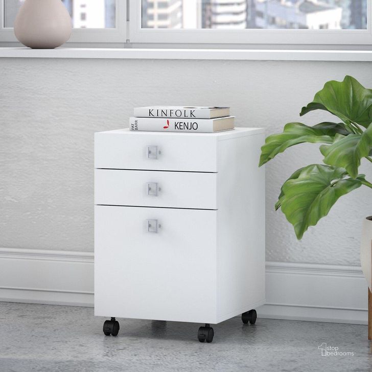 The appearance of Office by Kathy Ireland Echo 3 Drawer Mobile File Cabinet in Pure White designed by Bush Furniture in the modern / contemporary interior design. This white piece of furniture  was selected by 1StopBedrooms from Echo Collection to add a touch of cosiness and style into your home. Sku: KI60101-03. Product Type: Mobile Filing Cabinet. Image1