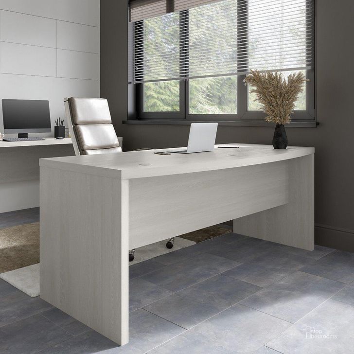 The appearance of Office By Kathy Ireland Echo 72W Bow Front Desk In Gray Sand designed by Bush Furniture in the modern / contemporary interior design. This sand piece of furniture  was selected by 1StopBedrooms from Echo Collection to add a touch of cosiness and style into your home. Sku: KI60209-03. Material: Wood. Product Type: Home Office Desk. Image1