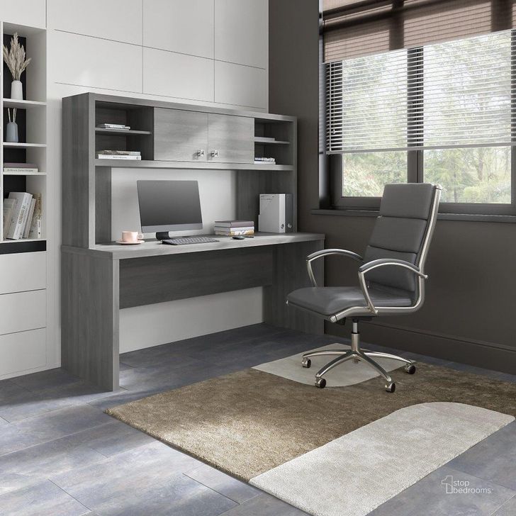 The appearance of Office By Kathy Ireland Echo 72W Computer Desk With Hutch In Modern Gray designed by Bush Furniture in the modern / contemporary interior design. This gray piece of furniture  was selected by 1StopBedrooms from Echo Collection to add a touch of cosiness and style into your home. Sku: ECH056MG. Material: Wood. Product Type: Desk & Hutch. Image1