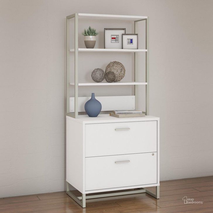 The appearance of Office by Kathy Ireland Method Lateral File Cabinet with Hutch in White designed by Bush Furniture in the modern / contemporary interior design. This white piece of furniture  was selected by 1StopBedrooms from Method Collection to add a touch of cosiness and style into your home. Sku: MTH012WHSU. Product Type: Lateral Filing Cabinet. Image1