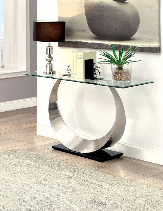 The appearance of Orla Sofa Table In Satin Plated and Black designed by Furniture of America in the modern / contemporary interior design. This satin and black piece of furniture  was selected by 1StopBedrooms from Orla Collection to add a touch of cosiness and style into your home. Sku: CM4726S-1;CM4726S-2. Product Type: Sofa Table. Table Top Shape: Rectangular. Material: Stainless Steel. Image1