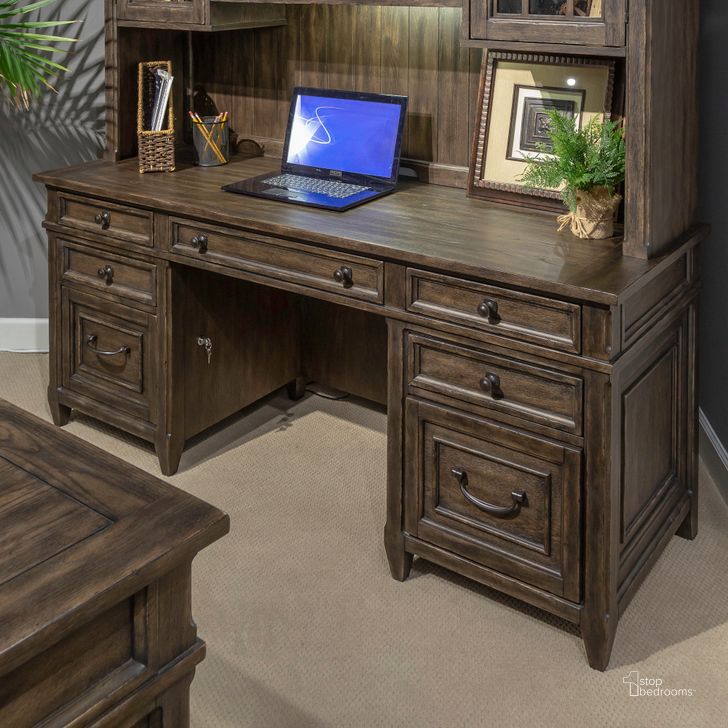 The appearance of Paradise Valley Executive Credenza In Saddle Brown designed by Liberty in the traditional interior design. This saddle brown piece of furniture  was selected by 1StopBedrooms from Paradise Valley Collection to add a touch of cosiness and style into your home. Sku: 297-HO120B;297-HO120T. Product Type: Credenza. Material: Rubberwood.