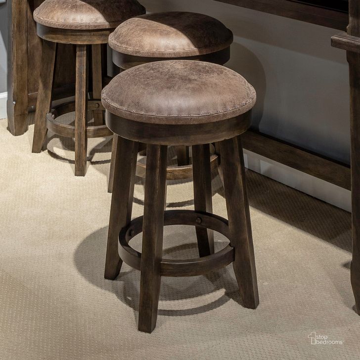 The appearance of Paradise Valley Upholstered Console Stool In Saddle Brown designed by Liberty in the traditional interior design. This saddle brown piece of furniture  was selected by 1StopBedrooms from Paradise Valley Collection to add a touch of cosiness and style into your home. Sku: 297-OT9001. Product Type: Barstool. Material: Rubberwood.