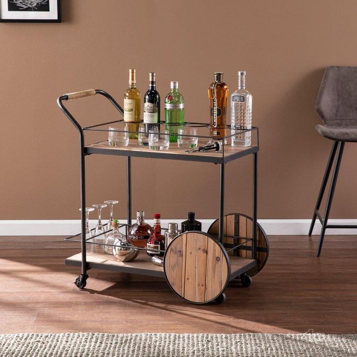 The appearance of Pemton Reclaimed Wood Bar Cart designed by SEI Furniture in the industrial interior design. This natural piece of furniture  was selected by 1StopBedrooms from Pemton Collection to add a touch of cosiness and style into your home. Sku: HZ1157540. Product Type: Bar Cart. Material: Iron. Image1