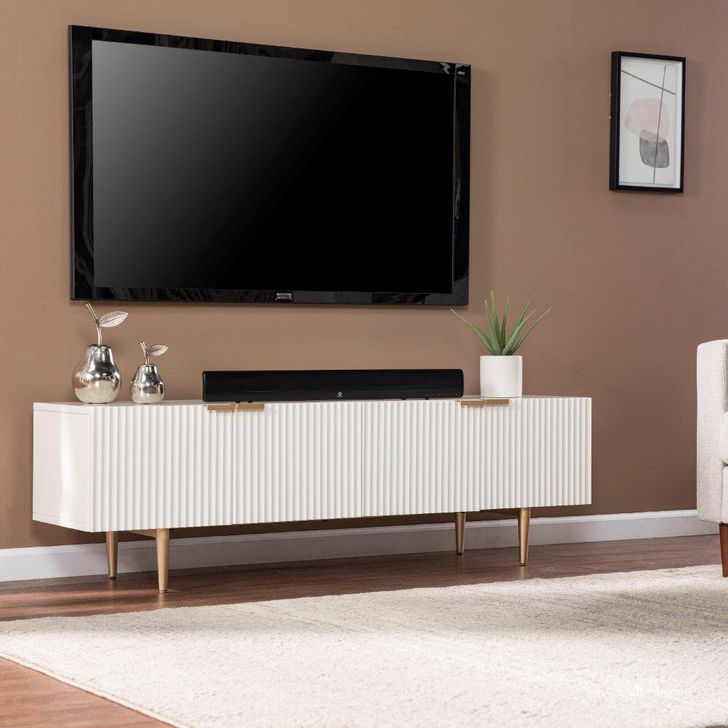 The appearance of Pilston 4-Door Media Console designed by SEI Furniture in the modern / contemporary interior design. This gold piece of furniture  was selected by 1StopBedrooms from Pilston Collection to add a touch of cosiness and style into your home. Sku: MS1135656. Material: Wood. Product Type: Media Console. Image1