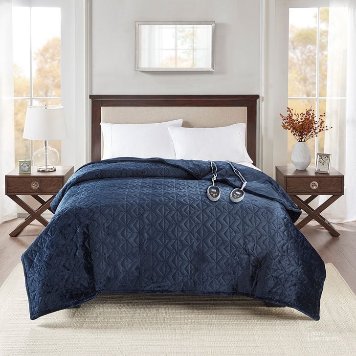 The appearance of Polyester Queen Microlight Pinsonic Heated Quilt In Navy designed by Olliix in the transitional interior design. This navy piece of furniture  was selected by 1StopBedrooms from Quilted Plush Collection to add a touch of cosiness and style into your home. Sku: BR13-1359. Bed Size: Queen. Product Type: Quilt Set. Image1