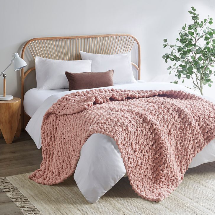 The appearance of Polyester Solid Chenille Chunky Knit Throw In Blush designed by Olliix in the transitional interior design. This blush piece of furniture  was selected by 1StopBedrooms from Chenille Chunky Knit Collection to add a touch of cosiness and style into your home. Sku: MP50-7675. Material: Polyester. Product Type: Throw. Image1