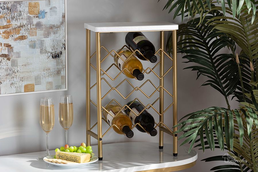The appearance of Ramona Modern and Contemporary Gold Finished Metal Wine Rack With Faux Marble Tabletop designed by Baxton Studio in the modern / contemporary interior design. This white and gold piece of furniture  was selected by 1StopBedrooms from Ramona Collection to add a touch of cosiness and style into your home. Sku: WS-12223-Wine Rack. Material: Marble. Product Type: Wine Rack. Image1