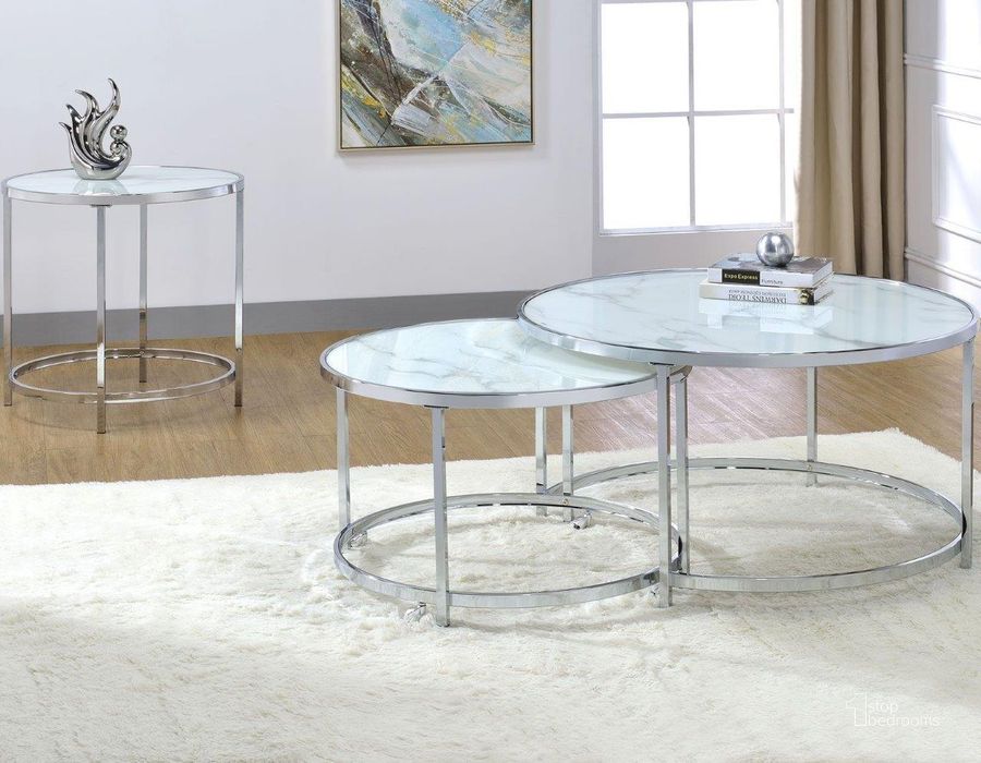 The appearance of Rayne White Nesting Occasional Table Set designed by Steve Silver in the transitional interior design. This chrome piece of furniture  was selected by 1StopBedrooms from Rayne Collection to add a touch of cosiness and style into your home. Sku: RY300NCW;RY300EW. Material: Faux Marble. Product Type: Occasional Table Set. Image1