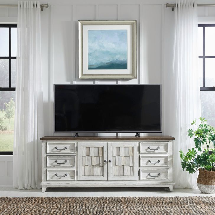 The appearance of River Place 75 Inch Entertainment Console In Riverstone White and Tobacco designed by Liberty in the country / farmhouse interior design. This white piece of furniture  was selected by 1StopBedrooms from River Place Collection to add a touch of cosiness and style into your home. Sku: 237-TV75. Product Type: Entertainment Console. Material: Wood Veneer.