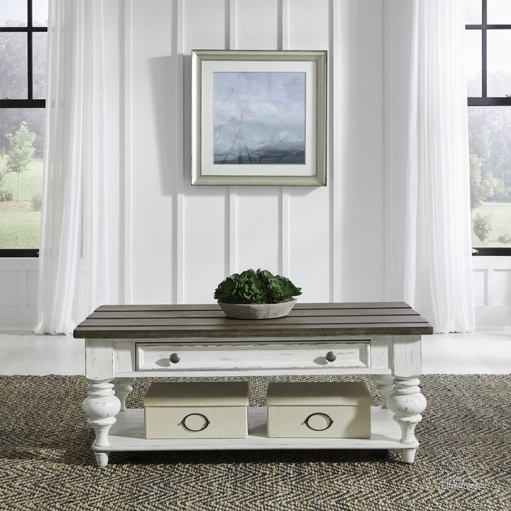 The appearance of River Place Cocktail Table In Riverstone White and Tobacco designed by Liberty in the country / farmhouse interior design. This white piece of furniture  was selected by 1StopBedrooms from River Place Collection to add a touch of cosiness and style into your home. Sku: 237-OT1010. Product Type: Cocktail Table. Material: Wood Veneer. Image1