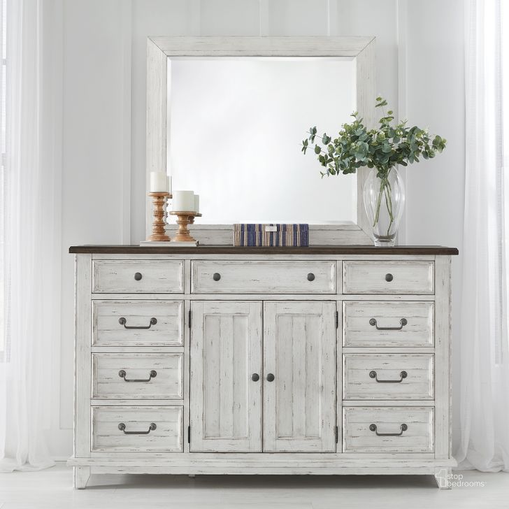 The appearance of River Place Dresser and Mirror In Riverstone White and Tobacco designed by Liberty in the country / farmhouse interior design. This white piece of furniture  was selected by 1StopBedrooms from River Place Collection to add a touch of cosiness and style into your home. Sku: 237-BR31;237-BR51. Product Type: Dresser and Mirror. Material: Wood Veneer.